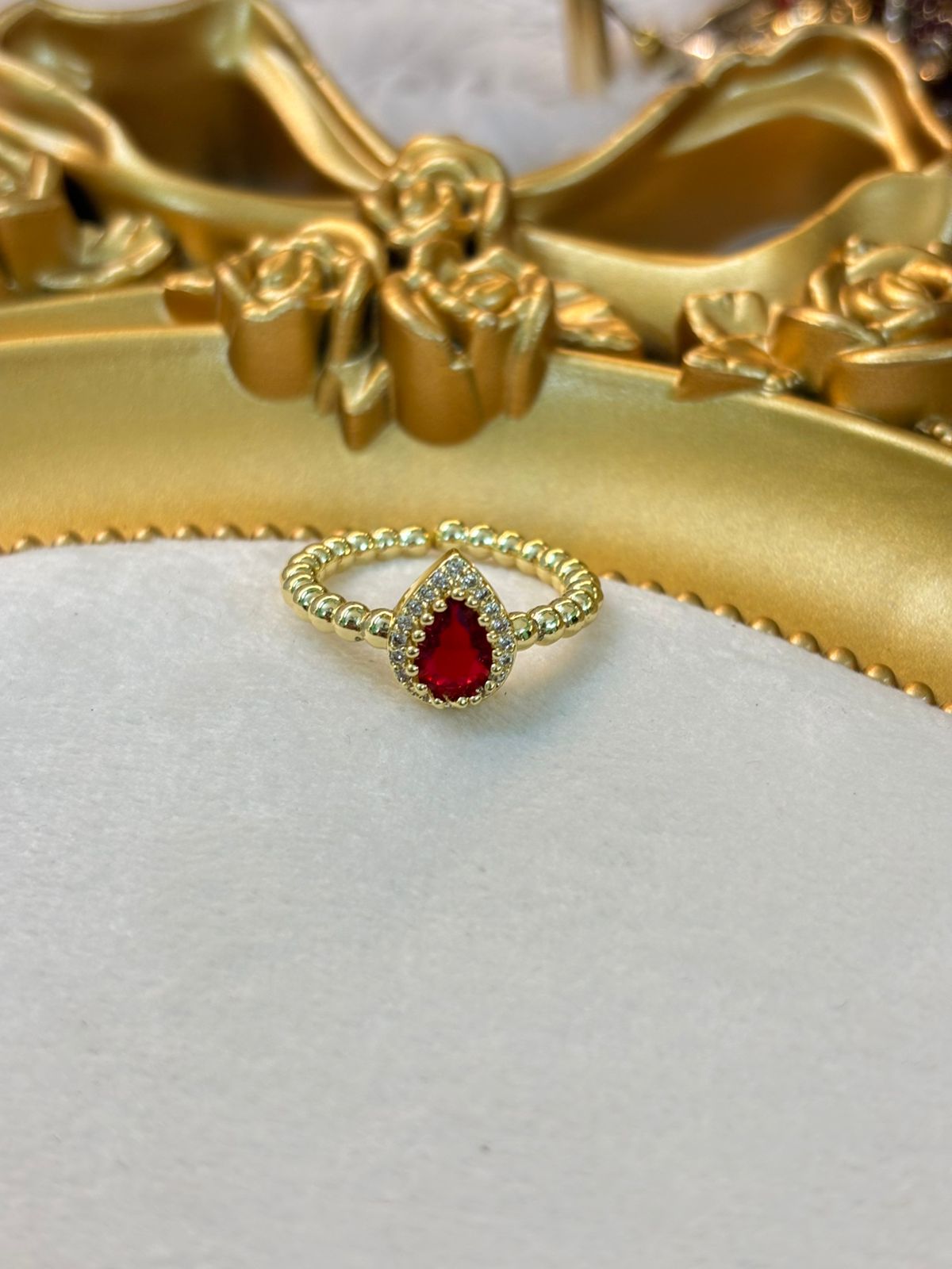 Red drop ring 109